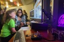 Avery Flannigan speaks to an amateur radio operator during an open club night at the University of Scranton.