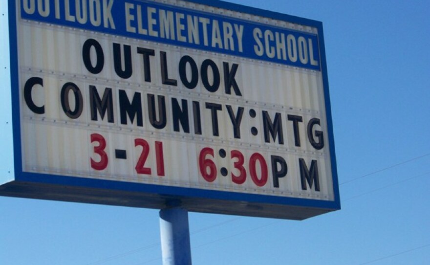 A sign promoting a community meeting in Outlook, Wash. a dairy town near Yakima.