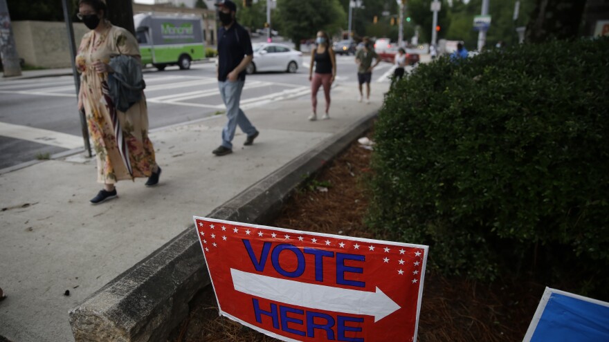 People wait in line to vote in Georgia's primary election on June 9 at Park Tavern in Atlanta.