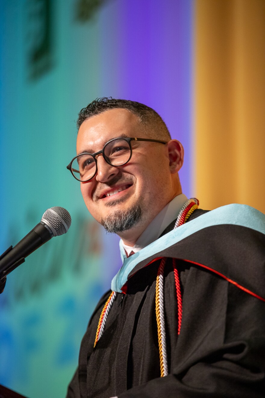 NexStep Alliance Director Yamir Lozada addresses the graduating class of 2026 during a ceremony on Thursday.