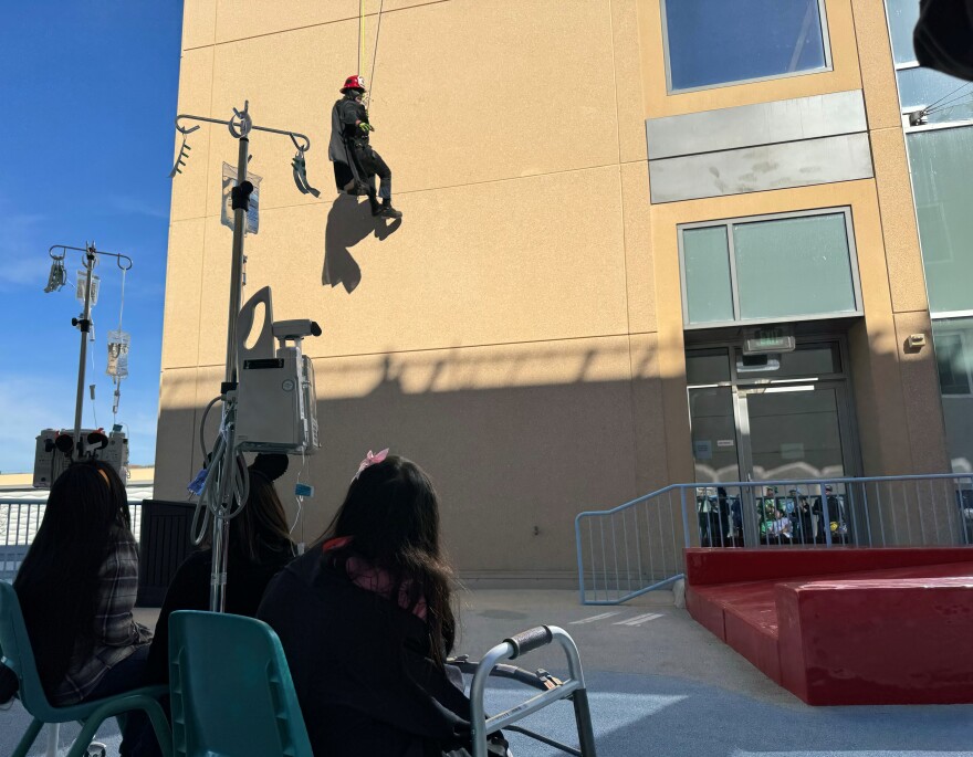 Batman rappelled down the side of the Medical Center