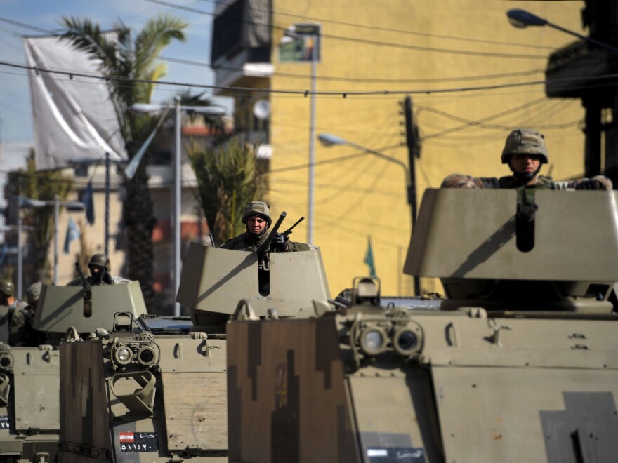 Lebanese soldiers patrol in the northern city of Tripoli on Sunday, Feb. 12, following clashes between Lebanese Sunni Muslims, who oppose Syria's regime, and Alawites, who support it. The rival Lebanese factions fired guns and rocket-propelled grenades at each other last week, killing three people.