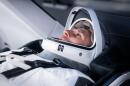 NASA astronaut and SpaceX Crew-13 Pilot Luke Delaney is pictured in his pressure suit and seated inside a SpaceX Dragon spacecraft during a training session at SpaceX headquarters in Hawthorne, California.