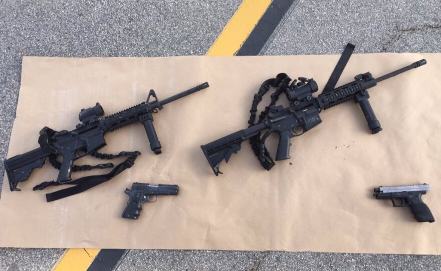 This image, released by the San Bernardino County Sheriff's office, shows some weapons and ammunition that were carried by the suspects in Wednesday's shooting.