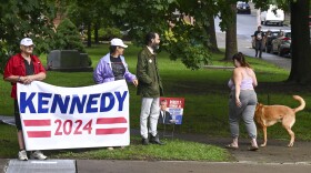 A small group of supporters wait for Independent presidential candidate Robert F. Kennedy Jr., to arrive at the Albany County Courthouse, Wednesday, Aug. 7, 2024, in Albany, N.Y. (AP Photo/Hans Pennink)