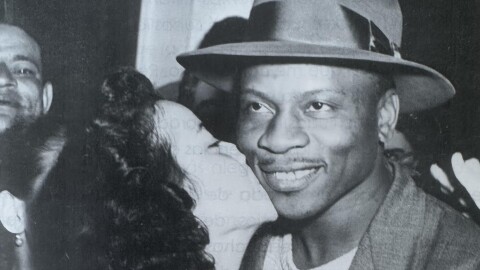Willard Brown, Louisiana-born baseball player and fourth Black player ever to play in the Major Leagues, receives a kiss at the Governor's Mansion in Puerto Rico, 1951