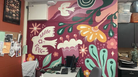 After their art classroom flooded, Riverside University High School art teacher Paige Bauske and her students painted this mural to bring color and new life back into the space. Many of the art materials were lost in the August 2025 floods.