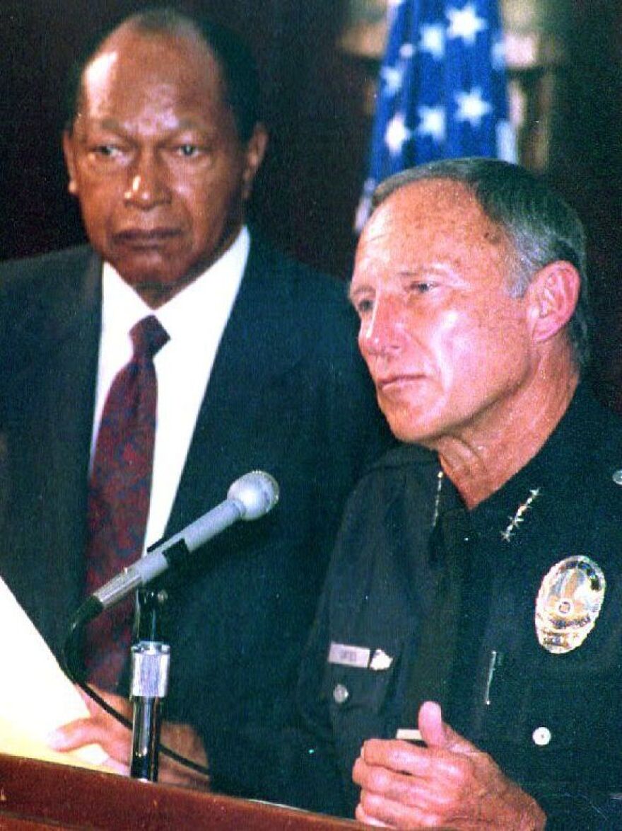 LAPD Chief Daryl Gates (right) and Los Angeles Mayor Tom Bradley respond to the rioting that began on April 30, 1992, after four police officers were acquitted in the beating of Rodney King.