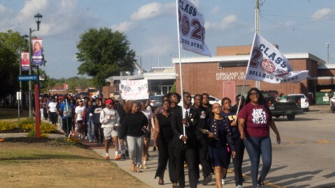 Students at South Carolina State University in Orangeburg County march through campus Wednesday, April 29.