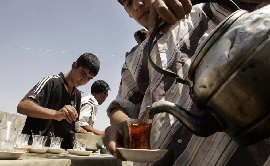 In Iraq, tea is simmered for about 15 minutes until strong and is then poured into glasses . diluted with hot water and sweetened with lots of sugar.