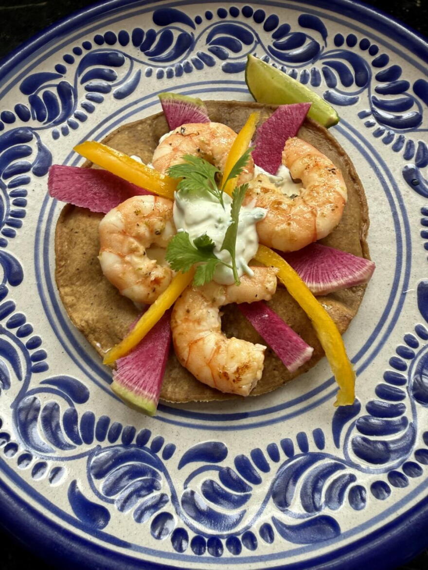 Shrimp tostadas with lime-cilantro cream, radishes, and peppers. (Kathy Gunst/Here & Now)