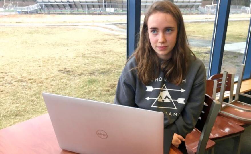 Grace Sikes at a Thunder Mountain High School robotics practice on April 9, 2019. Sikes does community outreach for the team, including visiting elementary school classrooms -- with robots. "It's really fun to see the younger generation excited about it," she said. (Photo by Zoe Grueskin/KTOO)