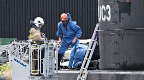 Police technicians investigate the rescued private-owned submarine UC3 Nautilus on Aug. 13, 2017 in Copenhagen Habor. Danish police said Sunday they searched a huge DIY submarine that sank last week in the hunt for a missing journalist who had been aboard before it sank, but no body was found. (Jens Noergaard Larsen/AFP/Getty Images)