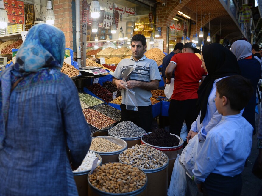 The unanimous ruling from the International Court of Justice orders the U.S. to allow Iran to import food, medical supplies and other products for humanitarian reasons. Here, people browse for goods in the Grand Bazaar in Tehran.