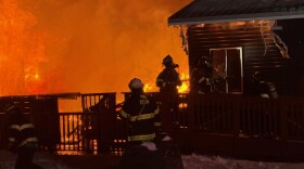 Firefighters douse flames at the Cannery Lodge on Thursday, Jan. 15, 2025 in Kenai, Alaska.