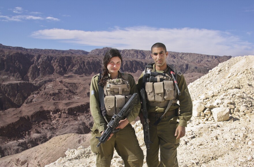 Sgt. Leora Prince (left) said switching to the Caracal battalion and taking on a more hands-on combat position was the best decision she'd ever made. She is shown here with her commanding officer, Capt. Yaron Eyal, near Eilat, along Israel's border with Egypt's Sinai Peninsula.