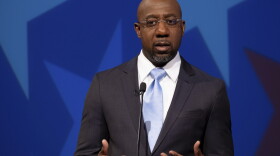 Democratic challenger for U.S. Senate Raphael Warnock speaks during a debate with Republican U.S. Sen. Kelly Loeffler, Sunday, Dec. 6, 2020, in Atlanta. (AP Photo/Ben Gray, Pool)