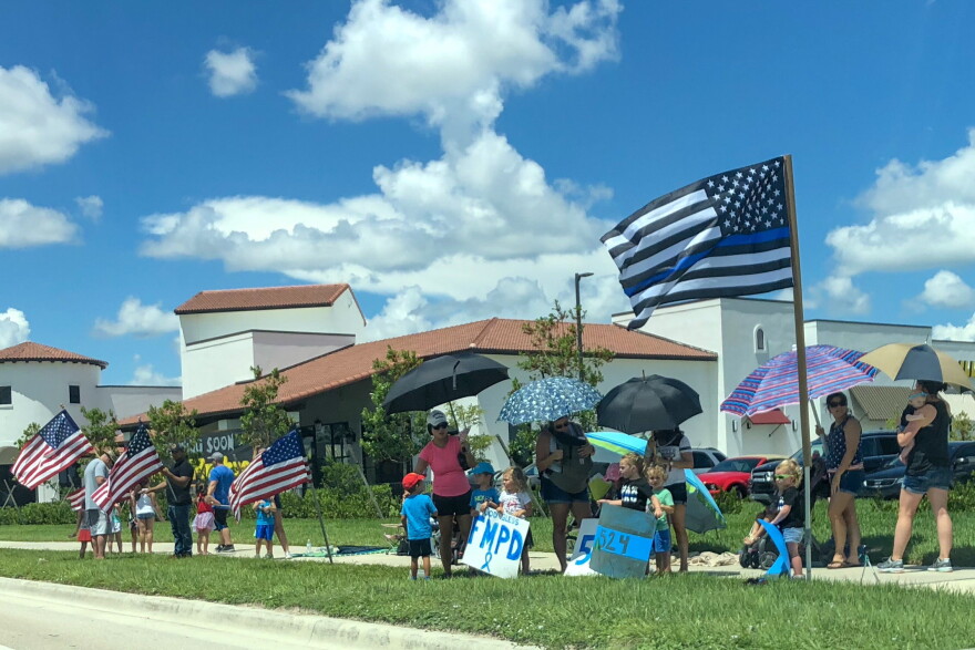 Crowds gathered along Ben Hill Griffin Parkway for the funeral procession of FMPD Officer Adam Jobbers-Miller