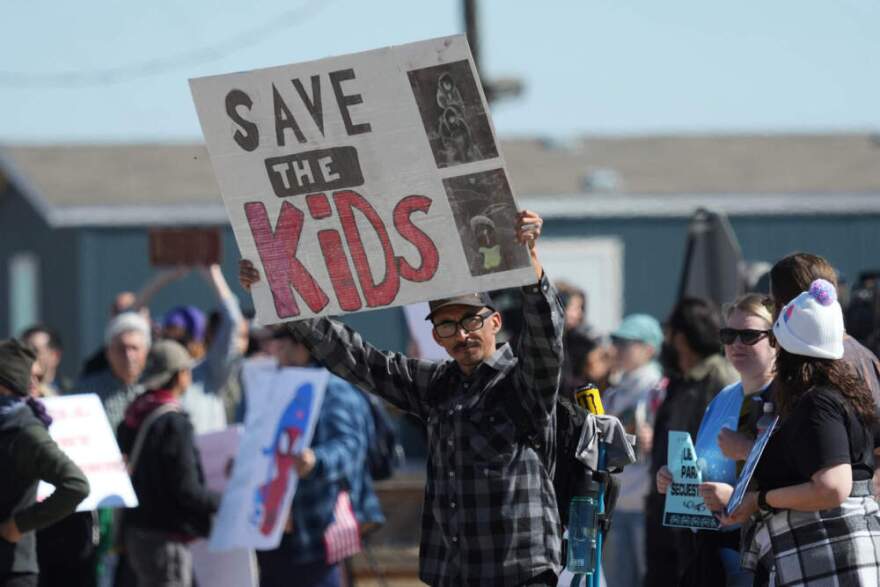 Protesters gather outside the South Texas Family Residential Center detention facility where Liam Ramos and his father are being detained in Dilley, Texas, Wednesday, Jan. 28, 2026. (Eric Gay/AP)