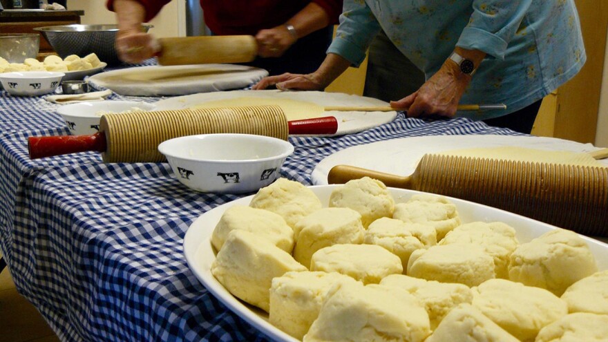 Two volunteers at Our Savior’s Lutheran Church in Bonner, Montana roll out lefse dough.