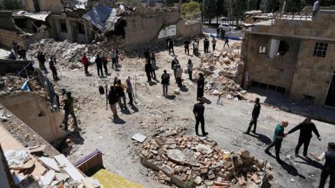 Journalists from foreign media based in Tehran document damage from U.S.-Israeli strikes in a residential area of the town of Fardis, west of Tehran, Iran, Friday, April 3, 2026. (Vahid Salemi/AP)