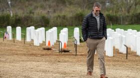 Ivar Lonon walks away from the plot where the remains of his father and mother were buried at Salisbury National Cemetery in Salisbury, N.C., on Thursday, March 26, 2020.