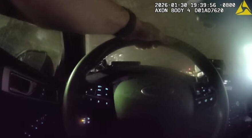Still from policeman's bodycam inside car. 