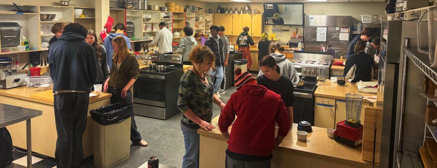 Students from the Ashland High School Culinary Program  preparing food in the school kitchen