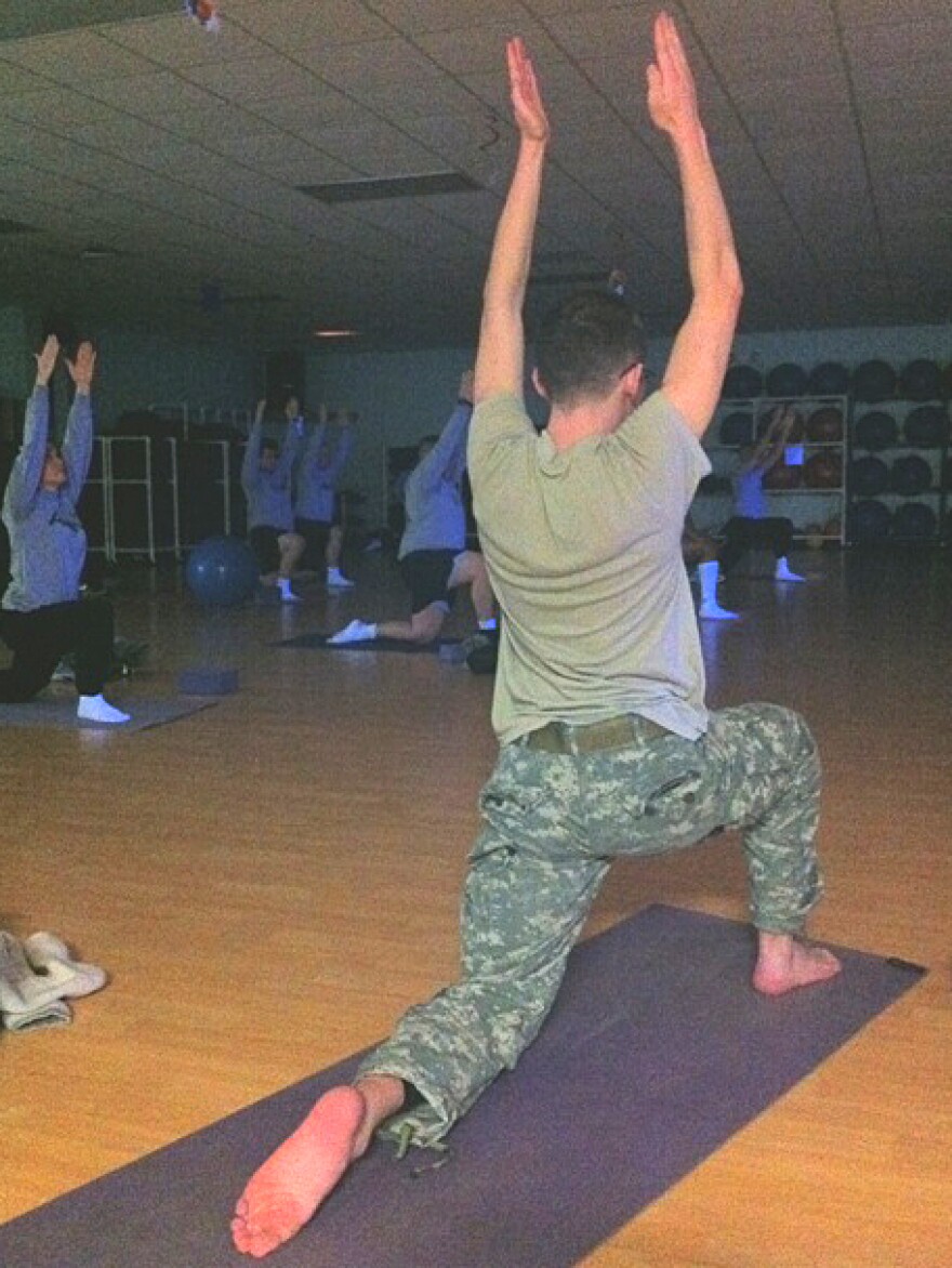 A soldier moves into the crescent pose at a daily yoga class offered at Fort Campbell in Kentucky.