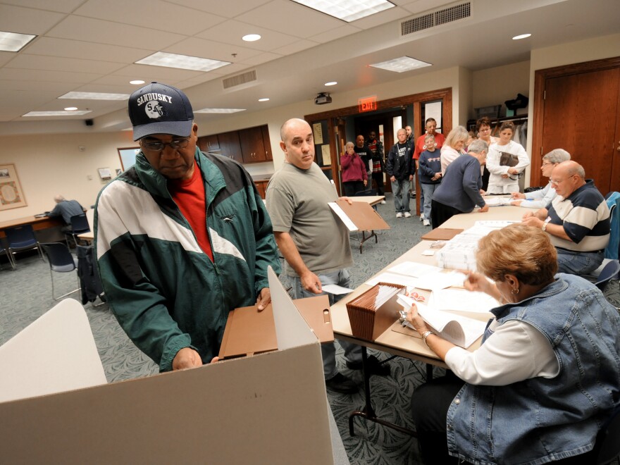 Commissioners in Sandusky, Ohio, have voted to make Election Day a city holiday, in place of Columbus Day. Sandusky resident Moses Croom is seen here voting at a polling station at a local library in November 2008. [Jason Werling / Sandusky Register]