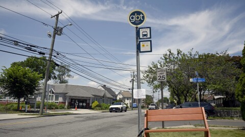 CT-DSA's just finished bus bench, chained to a bus stop pole near Bridgeport Hospital on 7/12/25. The bench is the first one of its kind in Bridgeport built by members of the CT-DSA following similar efforts by activists in Hartford.