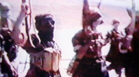 June 2001: al-Qaida members training in Afghanistan (frame grab from an al-Qaida video).