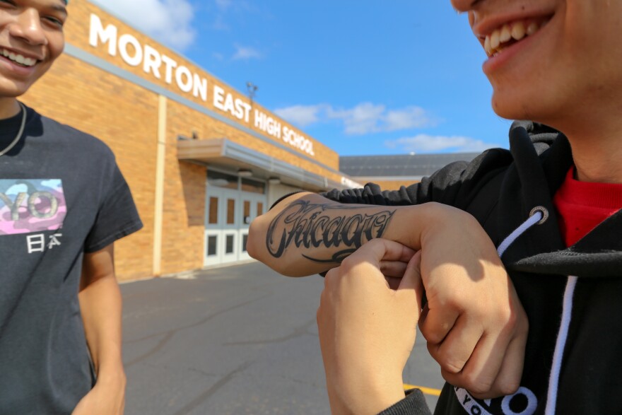 Julian Fausto shows off his "Chicago" tattoo.