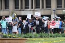 Protesters held signs silently in front of Cleveland State's Student Center. Many expressed outrage and sadness of at the abrupt closure and sale of the university's WCSB 89.3 to Ideastream Public Media.