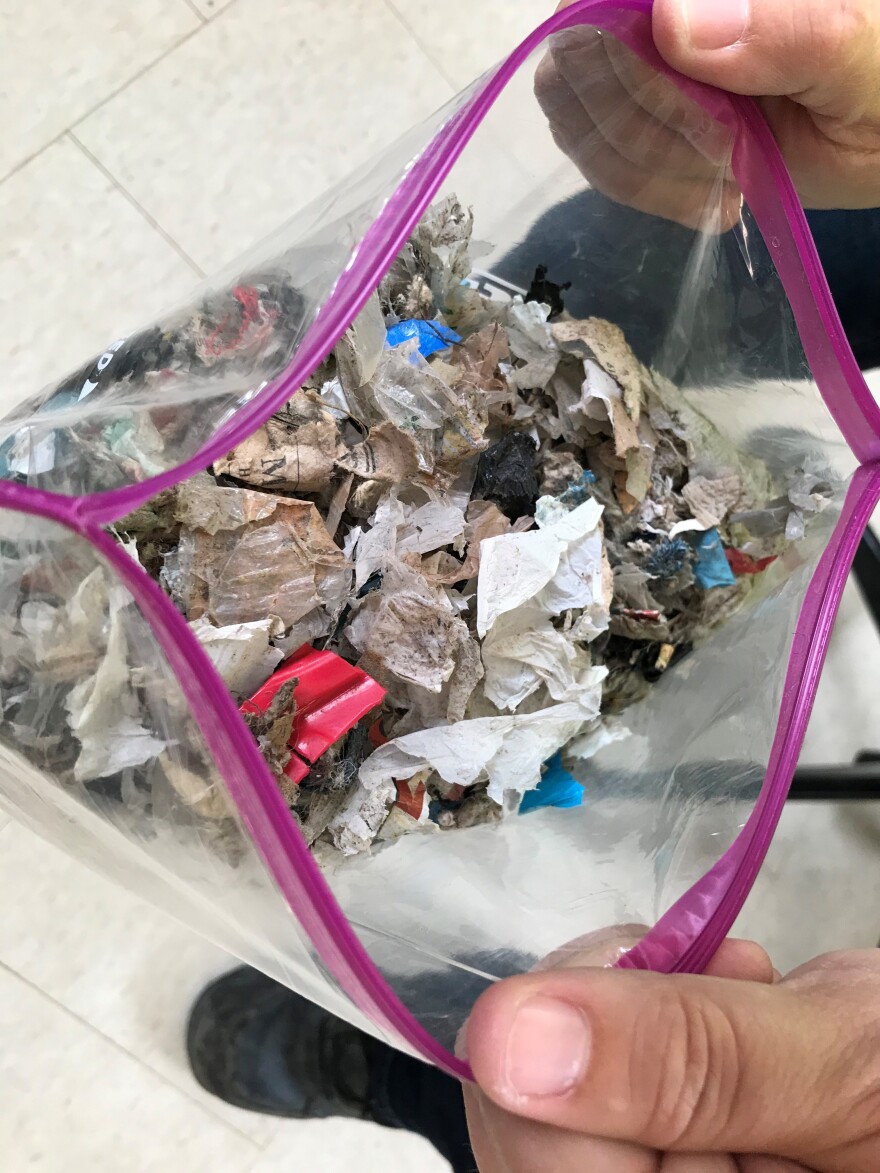 This is what garbage becomes after the Entsorga process. This confetti-like material can be burned as a fuel source. It's been shredded, cleaned and is safe to touch. 