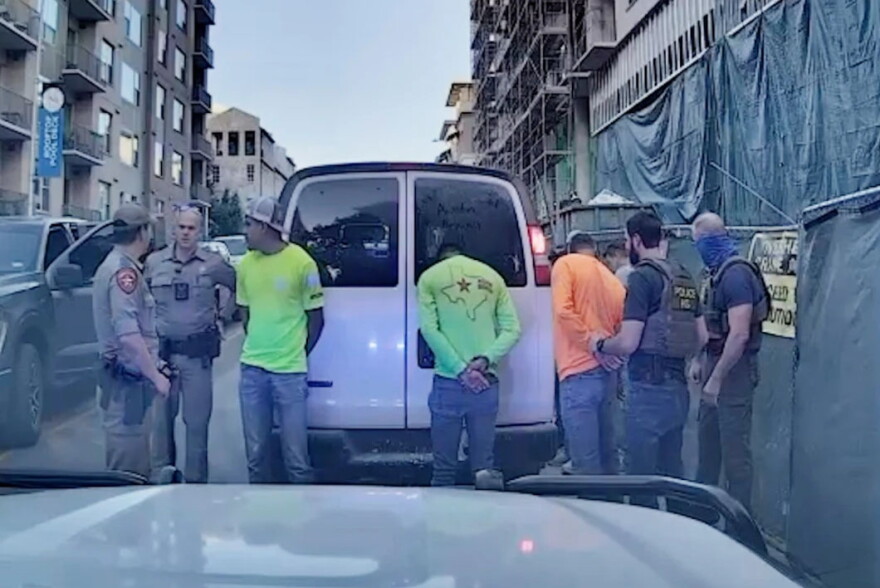 Texas DPS troopers and ICE agents detain construction workers after a traffic stop in East Austin in the summer of 2025.