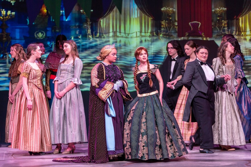 Students perform during a scene from "Frozen" at Conard High School on March 19, 2023 in West Hartford, Conn. At center stage, senior Kayla Resnisky plays Elsa and senior Marlena Pegolo plays Anna.