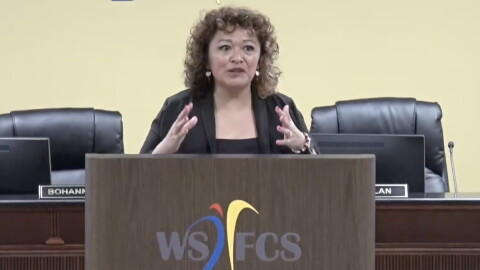Walkertown Middle School Principal Monica Comer speaks at a podium