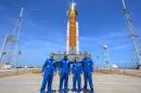 NASA astronauts Reid Wiseman, Artemis II commander, from left, Victor Glover, Artemis II pilot, Christina Koch, Artemis II mission specialist, and CSA (Canadian Space Agency) astronaut Jeremy Hansen, Artemis II mission specialist, right, in a group photograph as they visit NASA's Artemis II SLS (Space Launch System) rocket and Orion spacecraft, Monday, March 30, 2026, at Launch Complex 39B of NASA's Kennedy Space Center, in Cape Canaveral, Fla. (Bill Ingalls/NASA via AP)