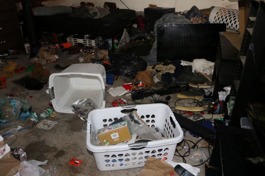 Interior photo of a bedroom inside the suspect's home.