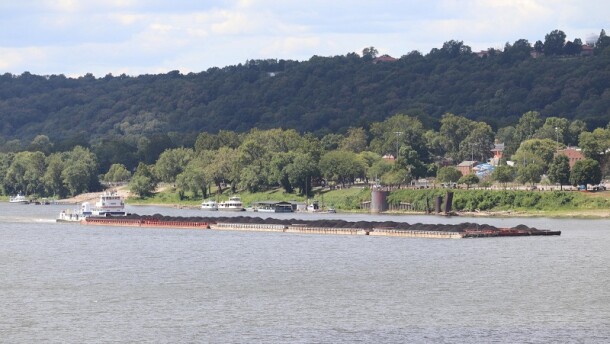 Barges loaded with coal pass Milton, KY on the Ohio River