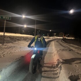 Tony Levario bikes to work in west Anchorage the morning of Feb. 4, 2026.