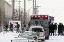 FBI agents enter the ABB Industries plant in north St. Louis. Four people were killed and five wounded in a morning shooting at the plant, which makes electrical transformers