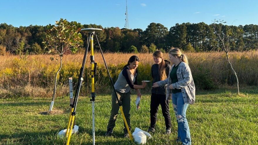 From left, Virginia Tech field team members Karen Williams, Madeline Kronebusch and Jasmine Floyd at a Global Navigation Satellite System site on the Eastern Shore.