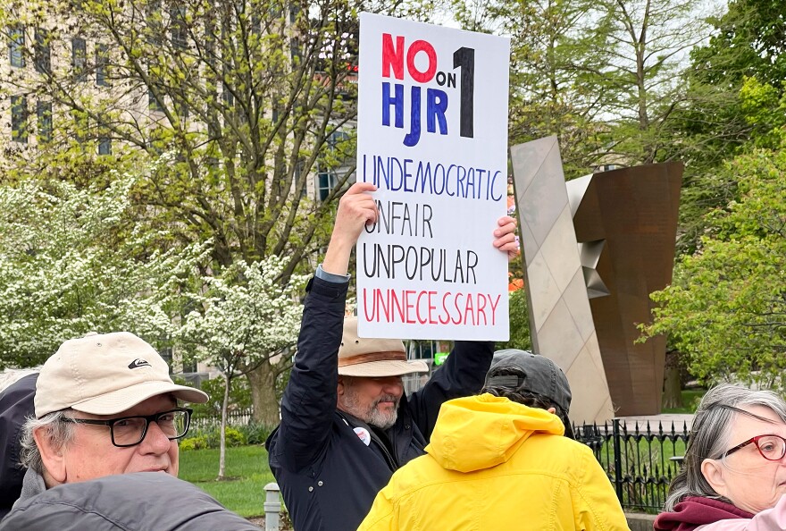 A protester holds a sign