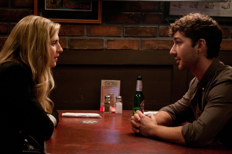 Rebecca (Brit Marling) is an unwilling and confused source for a brash young reporter (Shia LaBeouf) as he digs for the truth behind a violent unsolved 1970s bank heist in Michigan.