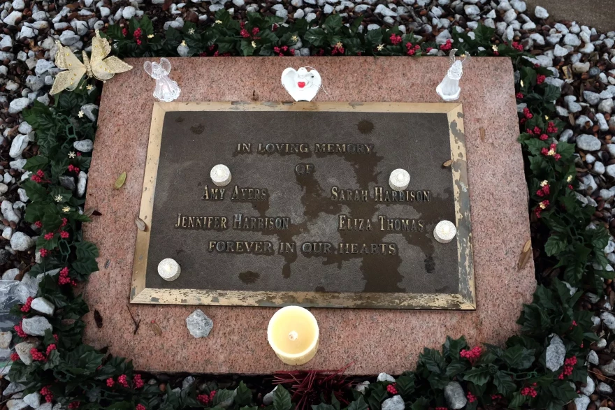A memorial plaque sits outside the former North Austin yogurt shop where four teenagers were murdered in 1991.