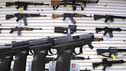 Assault style weapons and hand guns are displayed for sale at Capitol City Arms Supply on Jan. 16, 2013, in Springfield, Ill.