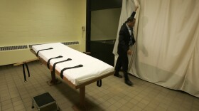 FILE - In this Nov. 2005 file photo, public information director Larry Greene is shown in the death chamber at the Southern Ohio Correctional Facility in Lucasville, Ohio. The state prisons agency announced Monday, June 29, 2015, that Ohio will test lethal injection drugs ahead of executions if it obtains specialty batches of the drugs, in its latest update of capital punishment rules. (AP Photo/Kiichiro Sato, File)
