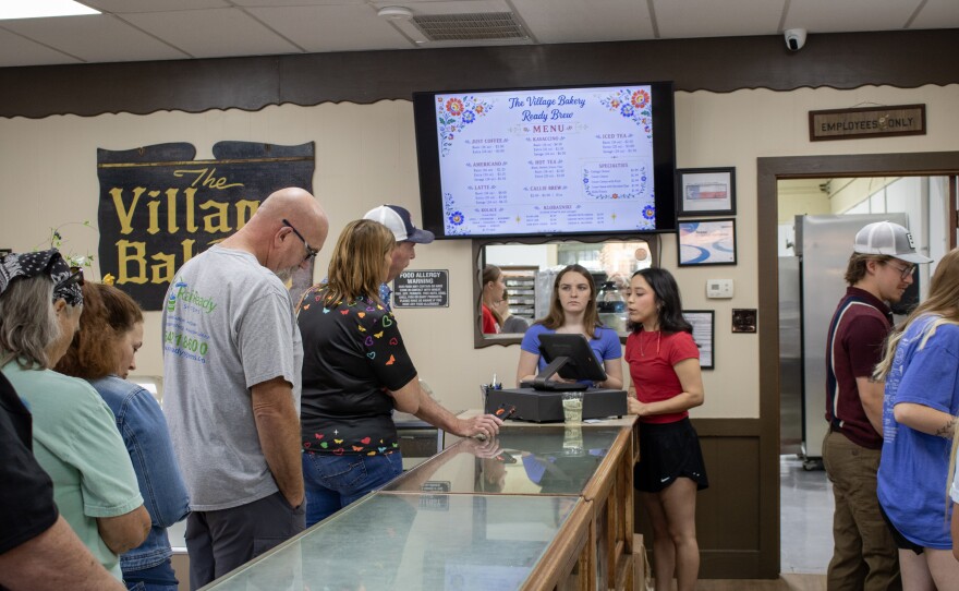 Customers wait in line at the Village Bakery in West, Texas during their grand reopening on May 23, 2026. The bakery, known for its kolaches, closed in 2019 following the death of owner Mimi Montgomery Irwin.
